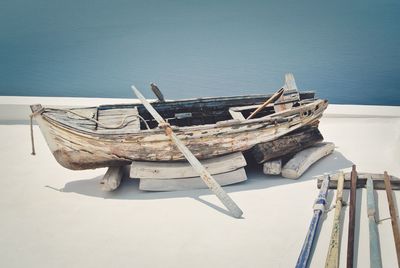 High angle view of fishing boats moored on sea against sky