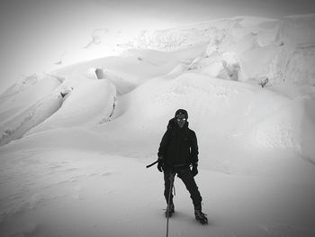 Man skiing on snow covered mountain