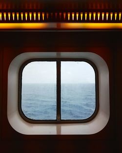 Scenic view of sea seen through window