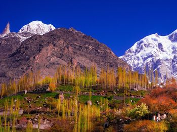 Scenic view of snowcapped mountains against clear sky