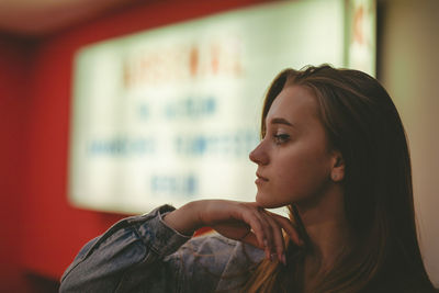 Close-up of young woman at home