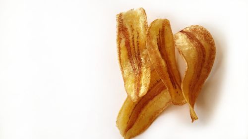 High angle view of banana against white background