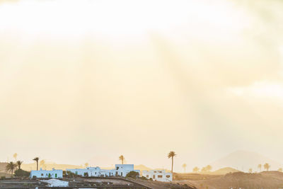 Built structure against sky at sunset