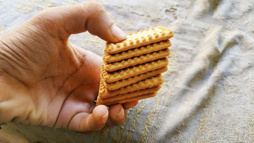 Close-up of hand holding bread