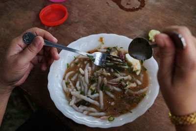 High angle view of person preparing food on table