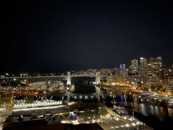 High angle view of illuminated buildings in city at night