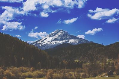 Scenic view of snowcapped mountains against sky