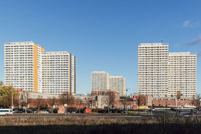 Buildings against clear blue sky