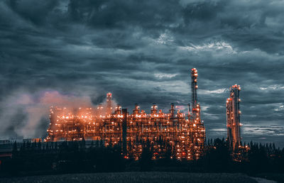 Factory against sky at night