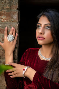 Young woman wearing traditional clothing while looking away