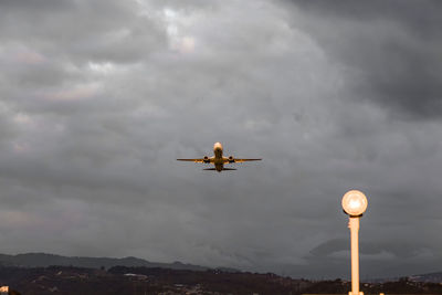 Low angle view of airplane in sky