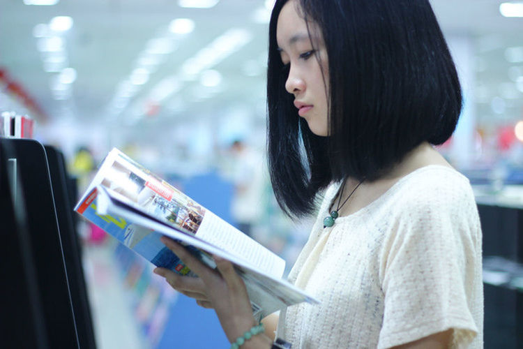 YOUNG WOMAN LOOKING AT CAMERA