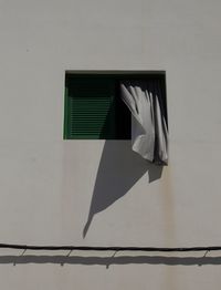 Low angle view of curtain hanging at window