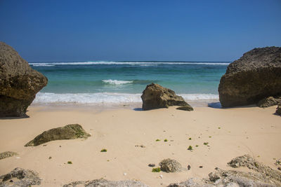 Scenic view of beach against clear sky