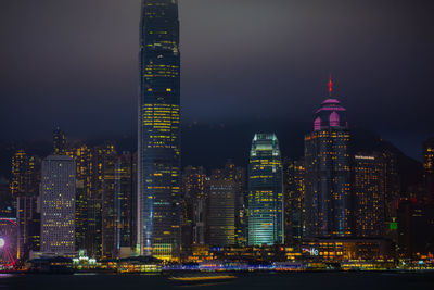 Illuminated buildings in city at night