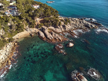 High angle view of rock formation in sea