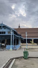 Low angle view of building against cloudy sky