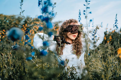 Portrait of woman on field