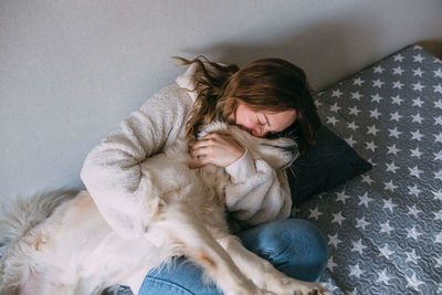 Portrait of a woman and her life-style labrador retriever at home