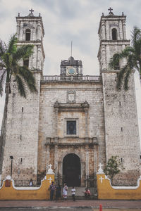 Clock tower against sky in city