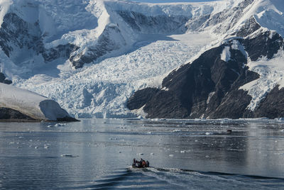 Man kayaking in sea