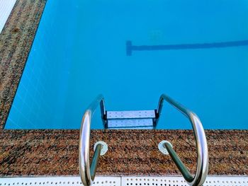 High angle view of swimming pool against blue sky