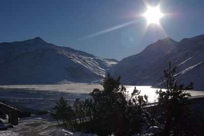 Scenic view of snowcapped mountains against sky