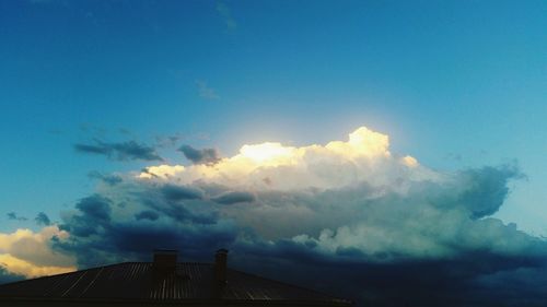 Low angle view of built structure against blue sky