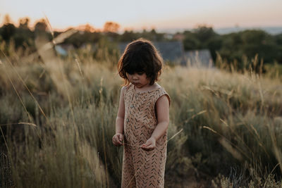 Girl standing on field