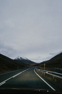 Empty road against sky