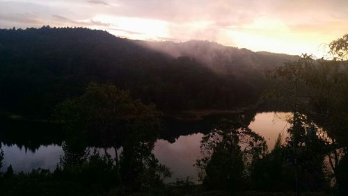 Scenic view of lake against sky during sunset