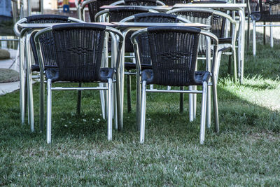 Empty chairs and tables in lawn