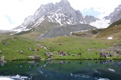 Scenic view of mountains and lake against sky