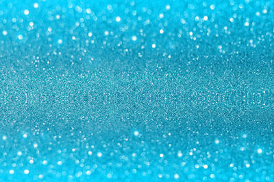 Abstract blue shiny glitter background.
