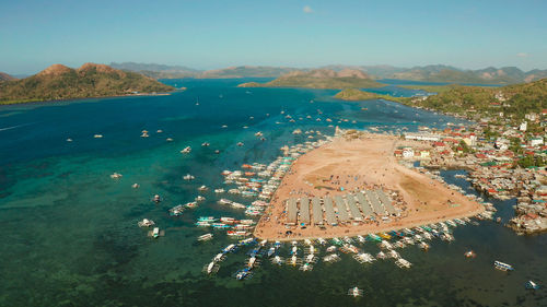 City quay with boat dock and public market coron town, tourist destination in the philippines.