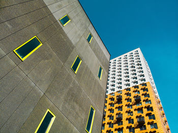 Low angle view of building against blue sky