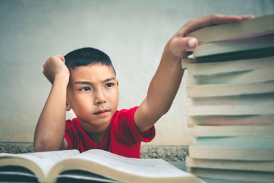 Portrait of boy holding book