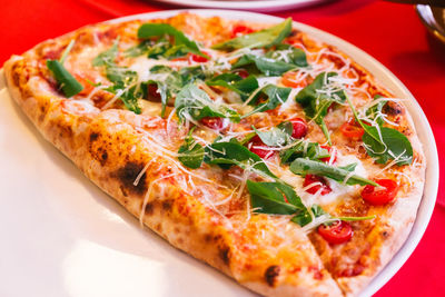 Close-up of pizza served on table