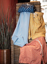 Close-up of clothes hanging on wicker basket