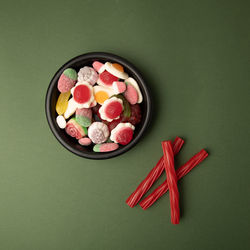 High angle view of multi colored candies on table