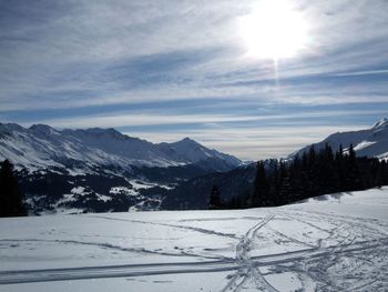 Scenic view of mountains against sky during winter