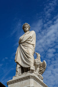 Low angle view of statue against sky