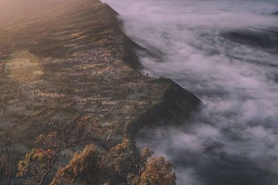 Aerial view by cloudscape by mountain