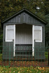 Trees with buildings in background