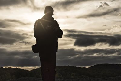 Silhouette of statue against sky during sunset