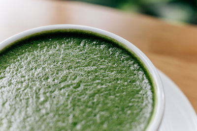 Close-up of green tea on table