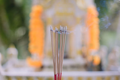 Close-up of cross against blurred background