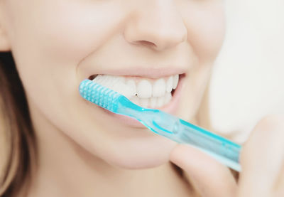 Close-up of woman brushing teeth