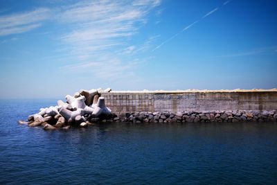 Panoramic view of rocks in sea against sky