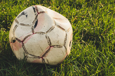 Close-up of soccer ball on field